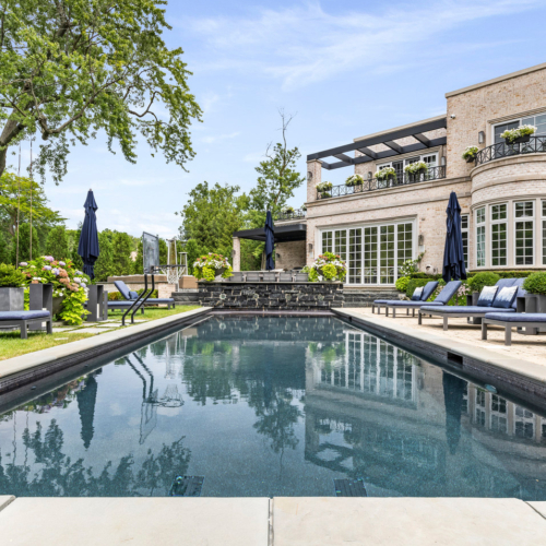 Image of the backyard of a transitional signature estate home built by Michael Bennett Homes®