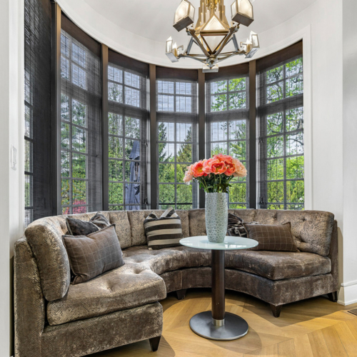 Image of a seating area inside a transitional signature estate home built by Michael Bennett Homes®